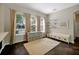 Spacious bonus room featuring large windows, tile flooring, and stylish decor, perfect for versatile living at 3698 Lower Park Rd, Orlando, FL 32814