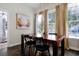 Cozy dining room with modern chandelier and large wood table at 3698 Lower Park Rd, Orlando, FL 32814