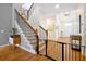Welcoming entryway featuring a staircase, wood floors, and stylish decor at 3698 Lower Park Rd, Orlando, FL 32814