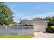 Beautiful home exterior with a lush lawn, fenced yard, and attached garage, offering comfort and convenience at 3698 Lower Park Rd, Orlando, FL 32814