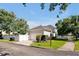 Charming home with a well-maintained lawn, white picket fence, and a welcoming entrance for a cozy curb appeal at 3698 Lower Park Rd, Orlando, FL 32814