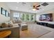 Spacious living room with a comfortable sectional sofa and large windows at 3698 Lower Park Rd, Orlando, FL 32814