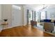 Inviting living room with hardwood floors, large windows with decorative curtains, and stylish contemporary furniture at 3698 Lower Park Rd, Orlando, FL 32814
