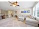 Upstairs loft featuring a comfortable sectional sofa and large windows at 3698 Lower Park Rd, Orlando, FL 32814