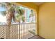 Balcony view with palm trees and a view of the street and nearby building at 3733 Cardinal Blvd # 1, Daytona Beach, FL 32118