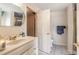 Bright bathroom featuring a white sink vanity and a partially opened door at 3733 Cardinal Blvd # 1, Daytona Beach, FL 32118