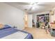 Bedroom featuring a ceiling fan, closet, and an entrance into another room at 3733 Cardinal Blvd # 1, Daytona Beach, FL 32118