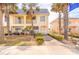 Charming two-story townhome with inviting curb appeal and lush, tropical landscaping at 3733 Cardinal Blvd # 1, Daytona Beach, FL 32118