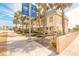 Inviting townhome complex with mature palm trees and well-maintained landscaping at 3733 Cardinal Blvd # 1, Daytona Beach, FL 32118