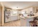 Well-lit kitchen features tile floors, all-white cabinetry, and modern appliances at 3733 Cardinal Blvd # 1, Daytona Beach, FL 32118
