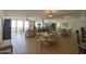 Open floor plan with dining area adjacent to living room and balcony access with ocean view at 3855 S Atlantic Ave # 1405, Daytona Beach, FL 32118