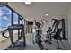 Bright gym features modern exercise equipment and a window with scenic views at 3855 S Atlantic Ave # 1405, Daytona Beach, FL 32118