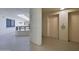 Elevator access on the floor with beige walls, neutral flooring, and clear signage at 3855 S Atlantic Ave # 1405, Daytona Beach, FL 32118