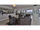 Spacious living room with comfortable seating, tile floors, and ocean views from the wall of windows at 3855 S Atlantic Ave # 1405, Daytona Beach, FL 32118