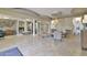 Inviting lobby area with tile flooring, a chandelier, seating, and decorative features at 3855 S Atlantic Ave # 1405, Daytona Beach, FL 32118