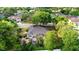 This aerial view showcases the home, enclosed pool, and lush green landscape at 397 Quail Hill Dr, Debary, FL 32713
