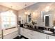 Bathroom featuring double sinks, chandelier lighting and tub at 397 Quail Hill Dr, Debary, FL 32713