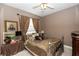 Comfortable bedroom with plush bedding, soft lighting, and window views at 397 Quail Hill Dr, Debary, FL 32713