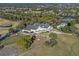 Aerial view of the clubhouse and pool at a beautiful community with meticulously maintained golf course and landscaping at 397 Quail Hill Dr, Debary, FL 32713