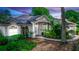 Charming single-story home with beautiful landscaping and a welcoming front entrance at 397 Quail Hill Dr, Debary, FL 32713