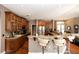 Open kitchen with granite countertops, stainless appliances, and breakfast bar at 397 Quail Hill Dr, Debary, FL 32713
