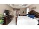 Spacious main bedroom featuring tray ceiling at 397 Quail Hill Dr, Debary, FL 32713