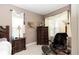 Main bedroom with dresser and accent chair at 397 Quail Hill Dr, Debary, FL 32713