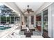 Outdoor patio area with a pool, ceiling fan, and comfortable seating at 397 Quail Hill Dr, Debary, FL 32713