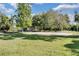 Community park featuring a playground, basketball court and shaded benches, ideal for outdoor activities and community engagement at 397 Quail Hill Dr, Debary, FL 32713