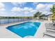 Outdoor pool features a lake view and lounge chairs, providing a perfect setting for relaxation and community enjoyment at 397 Quail Hill Dr, Debary, FL 32713