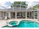 Covered pool area provides respite from the sun with the interior living space easily accessible at 397 Quail Hill Dr, Debary, FL 32713