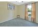Empty bedroom features neutral walls and carpet plus one window providing natural light at 416 N Blue Lake Ter, Deland, FL 32724