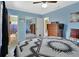 Bright blue bedroom showing mirrored closets and en-suite bathroom access at 416 N Blue Lake Ter, Deland, FL 32724