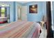 Bright bedroom with carpeted floors, and view of ensuite bathroom and closet at 416 N Blue Lake Ter, Deland, FL 32724