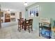 Cozy dining area with a wooden table and chairs set on tile flooring at 416 N Blue Lake Ter, Deland, FL 32724