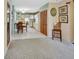 Open-concept living room area with a view of the adjacent kitchen and wood-look vinyl flooring at 416 N Blue Lake Ter, Deland, FL 32724