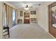 Well-lit living room featuring a ceiling fan, carpeted floors, and classic furnishings at 416 N Blue Lake Ter, Deland, FL 32724