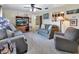 Inviting living room featuring comfortable seating, a ceiling fan, and natural light creating a cozy atmosphere at 416 N Blue Lake Ter, Deland, FL 32724