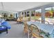 Bright sunroom features a casual dining area with backyard views and a comfortable sitting area at 416 N Blue Lake Ter, Deland, FL 32724