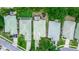 Overhead view showcasing well-maintained homes with light-green roofs and lush landscaping in a friendly neighborhood at 470 Foxhill Dr, Debary, FL 32713