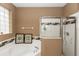 Bright bathroom featuring a soaking tub, glass block window and separate tiled shower at 470 Foxhill Dr, Debary, FL 32713