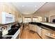 Bright kitchen boasts granite countertops, stainless appliances, and wood floors at 470 Foxhill Dr, Debary, FL 32713