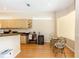Bright kitchen features a breakfast nook, countertops, light wood cabinets, and modern appliances at 470 Foxhill Dr, Debary, FL 32713