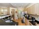 Well-lit kitchen with granite countertops, stainless steel sink, and ample cabinet space at 470 Foxhill Dr, Debary, FL 32713