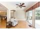 Relaxing living area featuring a ceiling fan and access to the lanai at 470 Foxhill Dr, Debary, FL 32713