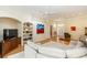 Inviting living room featuring bright neutral color palette, built-in shelving, and hardwood floors at 470 Foxhill Dr, Debary, FL 32713