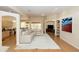 Open-concept living area with ample seating, a large area rug, and seamless flow to the kitchen at 470 Foxhill Dr, Debary, FL 32713