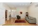 Bright living room featuring hardwood floors, high ceilings, and a welcoming neutral color palette at 470 Foxhill Dr, Debary, FL 32713
