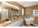 The main bathroom has a double vanity, soaking tub, and walk-in shower at 470 Foxhill Dr, Debary, FL 32713