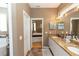 The bathroom offers a double vanity, ample counter space, and tile flooring at 470 Foxhill Dr, Debary, FL 32713